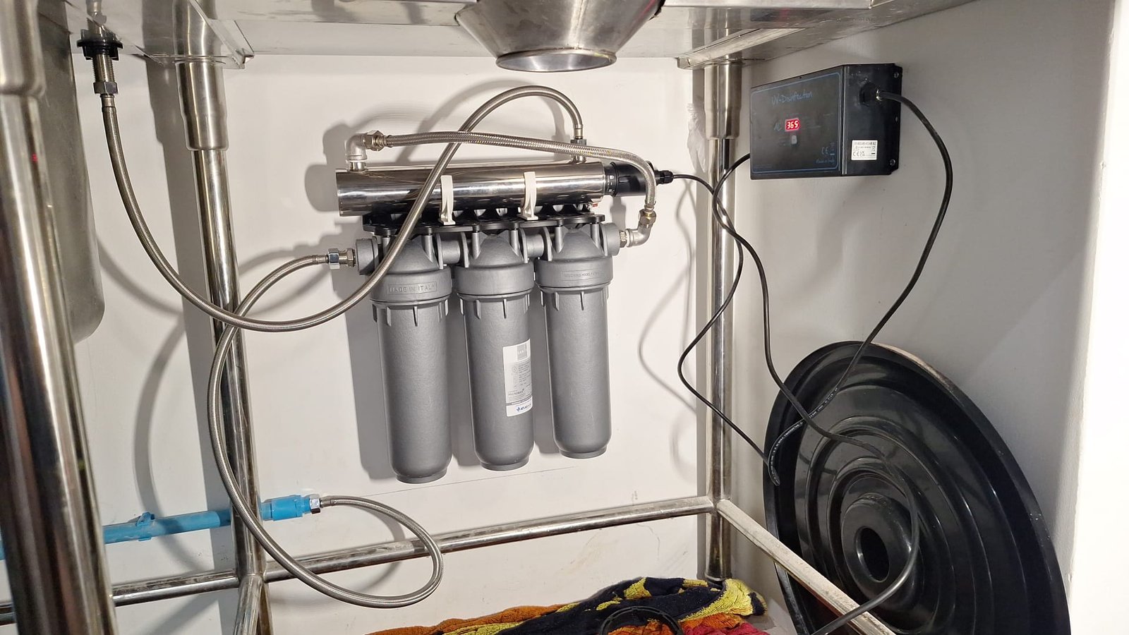 Nord 10 triple filtration and UV system installed beneath a commercial kitchen sink
